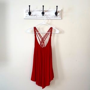 Red flowy blouse with gold strap detail